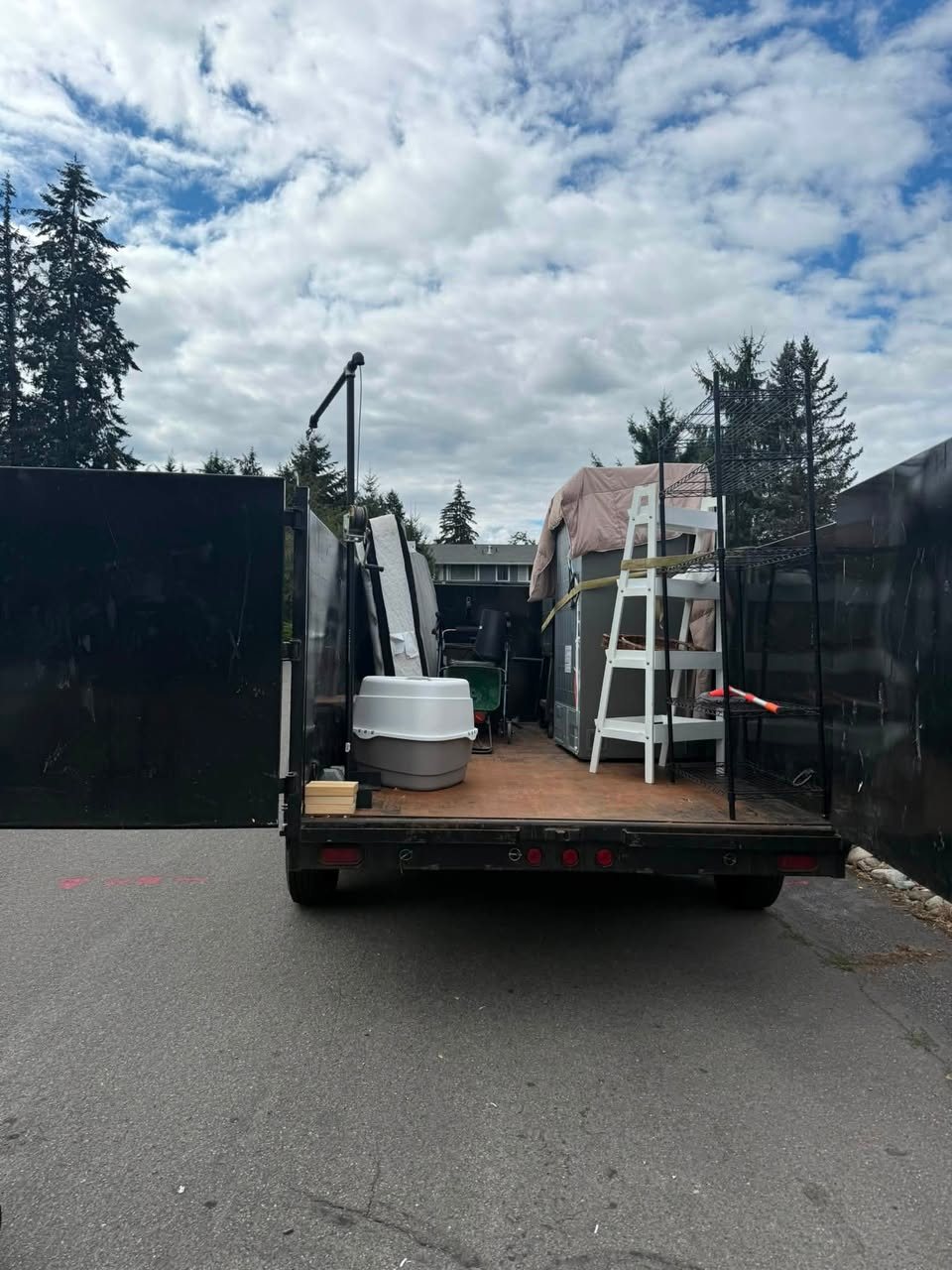 Trailer loaded with furniture and household items