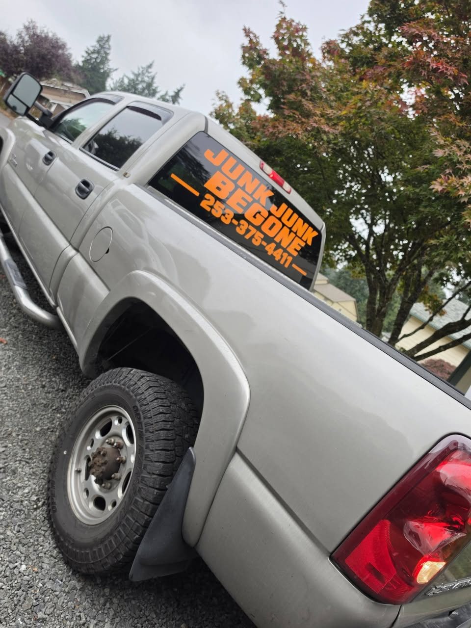 Junk Junk Begone branded pickup truck