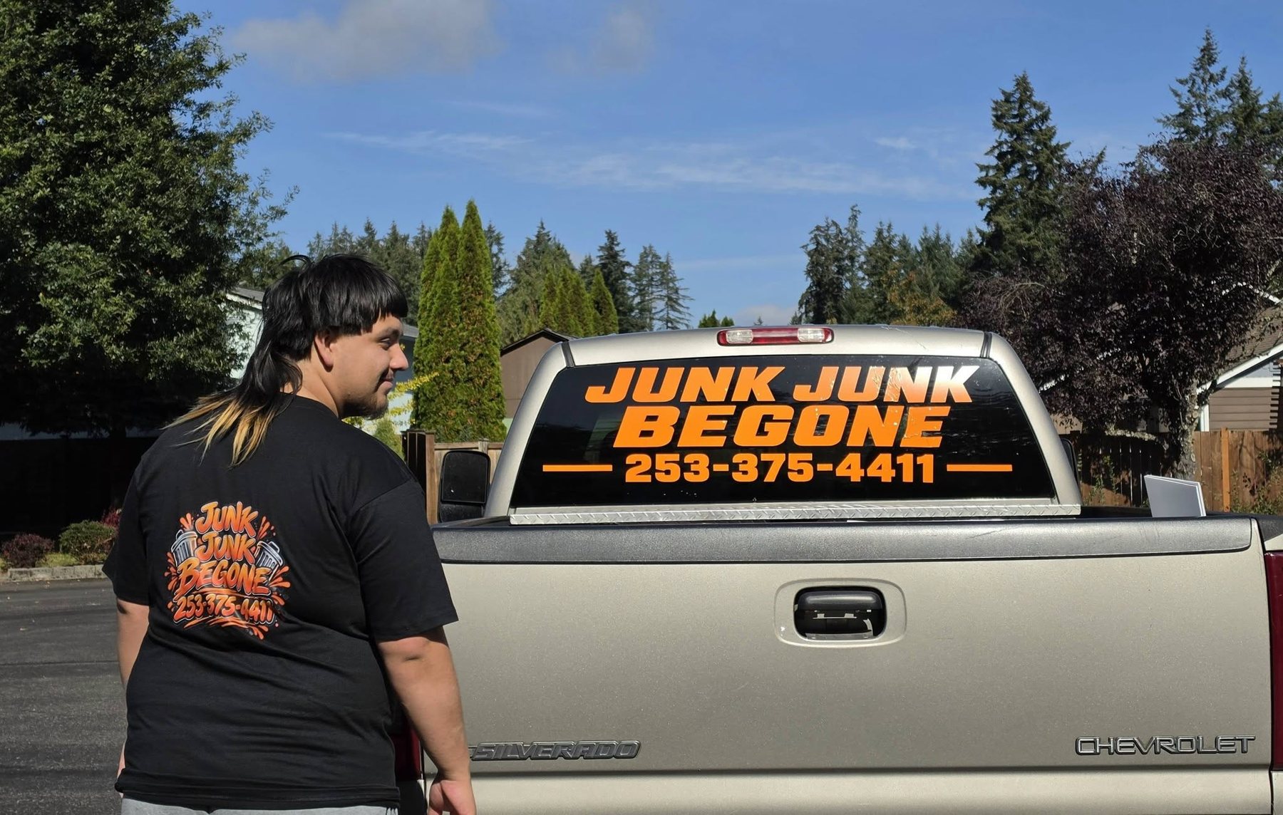 Junk Junk Begone branded truck and work shirt